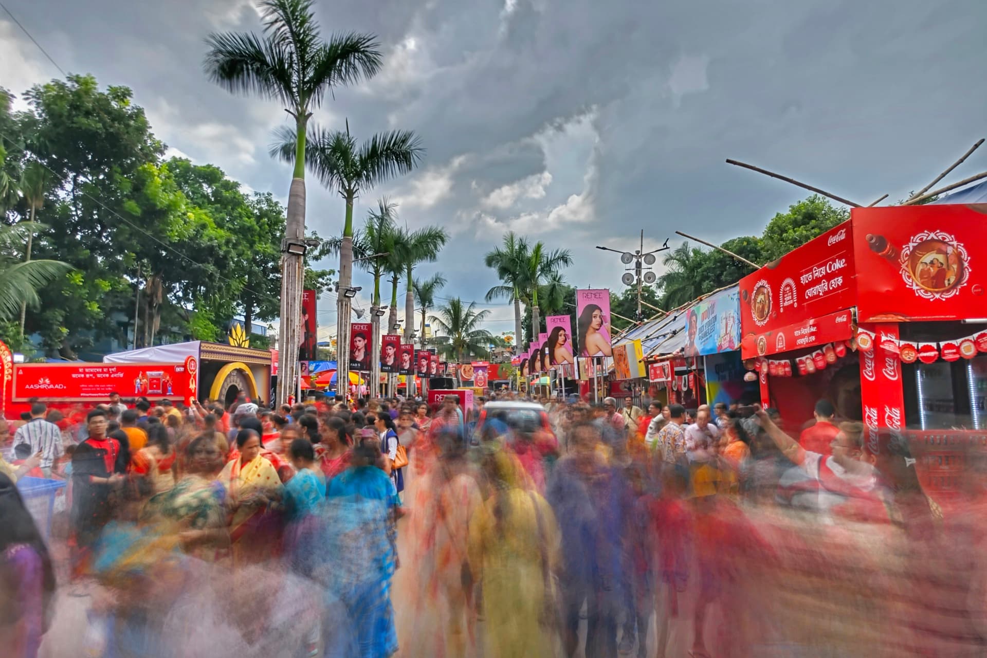 a crowd of people walking down a street